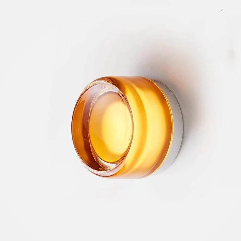 Nordic LED Wall Sconce with amber glass shade on a white wall; minimalist metal design